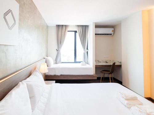 Postel nebo postele na pokoji v ubytování B2 Khon Kaen Premier Hotel