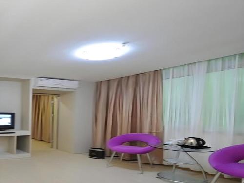 TV a/nebo společenská místnost v ubytování Wanxiang Hotel