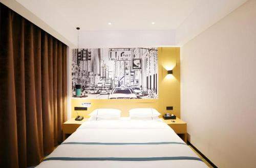 Ένα ή περισσότερα κρεβάτια σε δωμάτιο στο City Comfort Inn Enshi Nver Town