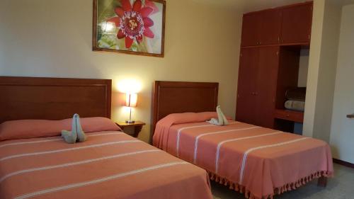 Кровать или кровати в номере Hotel Florida Oaxaca