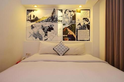 Postel nebo postele na pokoji v ubytování The Silk at Dago Boutique Hotel