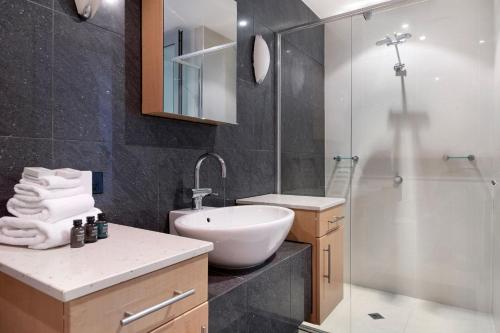 a bathroom with a sink toilet and a shower at Waterfront Oasis in Runaway Bay - CoastHM in Gold Coast