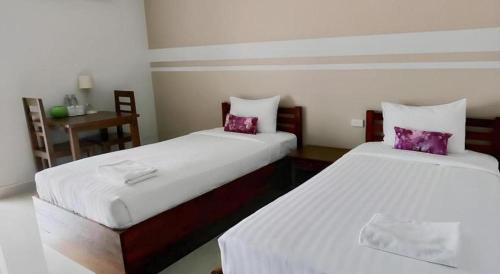 Letto o letti in una camera di Iyara Residence