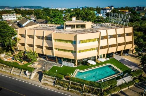 an aerial view of a building with a swimming pool at Bangsaen Villa Hotel in Si Racha