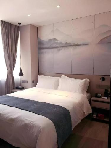 Cama o camas de una habitación en Shenzhen Hanyong Hotel Fuyong Branch