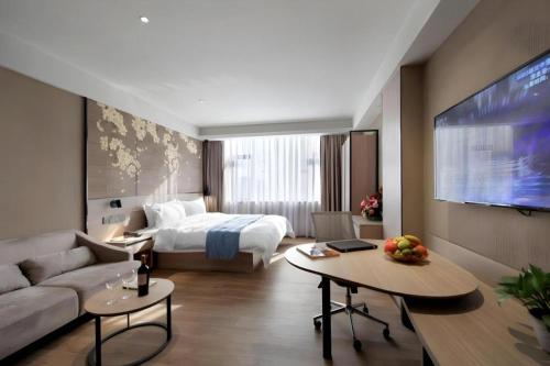 Cama o camas de una habitación en Shenzhen Hanyong Hotel Fuyong Branch