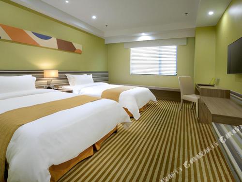 Кровать или кровати в номере Xiamenair Maple Hotel (Xiamen SM City Plaza)