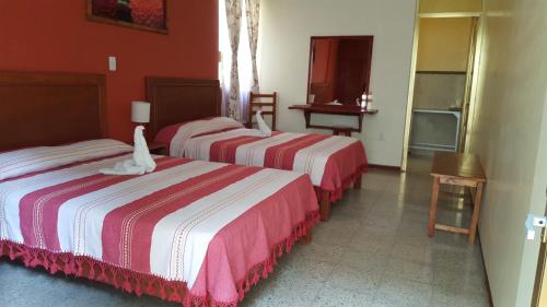 Кровать или кровати в номере Hotel Florida Oaxaca