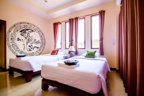 Кровать или кровати в номере Wake Up at Muang Kao Boutique Hotel