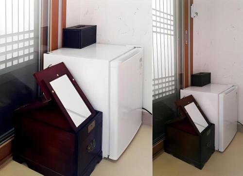 a white refrigerator with two boxes on top of it at Nabijam Hanok Hotel in Jeonju