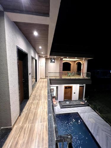 a room with a pool in the middle of a house at BluSplash Private Pool Villa in Lakāwās