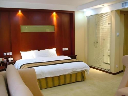 Postel nebo postele na pokoji v ubytování Heilongjiang Kunlun Hotel