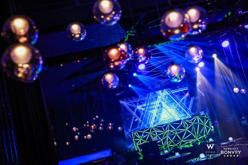 a bunch of lights hanging from a ceiling at W Chengdu in Chengdu