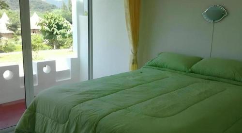 Ένα ή περισσότερα κρεβάτια σε δωμάτιο στο Banrai Pornsawun
