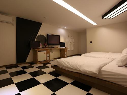 Cama o camas de una habitación en Java Hotel