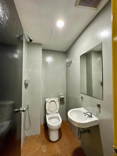 a bathroom with a toilet and a sink at Hotel MSP Bukit Bintang in Kuala Lumpur