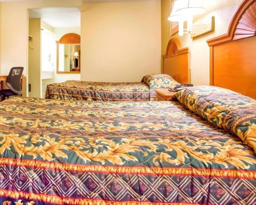 a hotel room with two beds in a room at Rodeway Inn Mount Laurel Hwy 73 in Mount Laurel