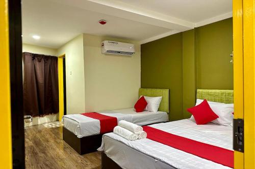 Postel nebo postele na pokoji v ubytování Hotel MSP Bukit Bintang