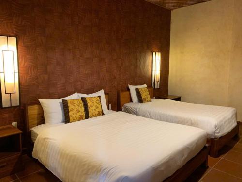 Cama o camas de una habitación en Melon Resort & Pickleball Club Mũi Né