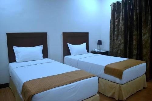 Кровать или кровати в номере Castle Dreams Hotel
