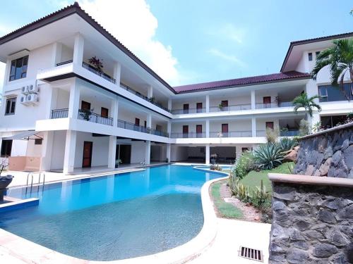 an image of a hotel with a swimming pool at Ole Suite Hotel and Cottage in Bogor