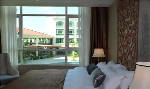 Кровать или кровати в номере San Jiang Grand Hotel