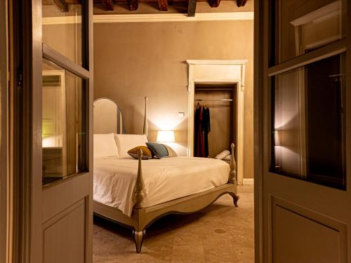 a bedroom with a bed in a room at Saint Amand by Palazzo Boyl in Cagliari