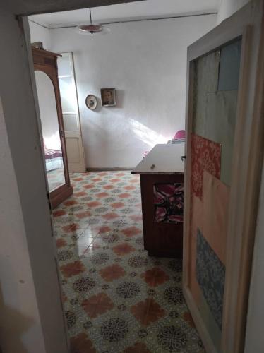 a hallway with a room with a table and a floor at Gabriella's in Capranica