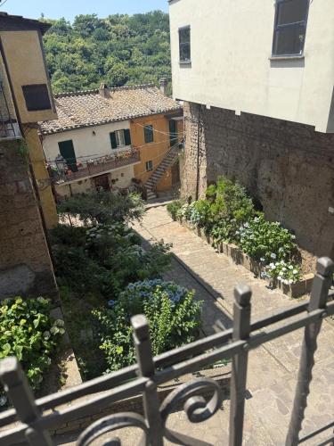 a view from a balcony of a house and a garden at Gabriella's in Capranica