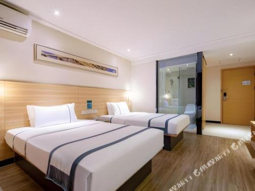 Letto o letti in una camera di City Comfort Inn Nanning Railway Station