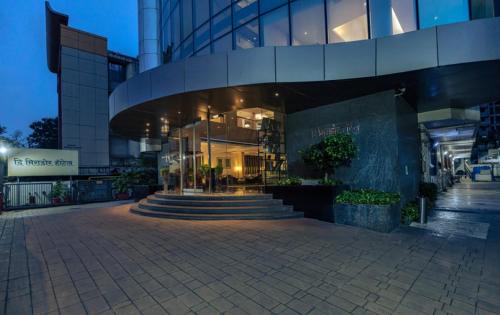 a building with a staircase in front of it at The Mirador in Mumbai