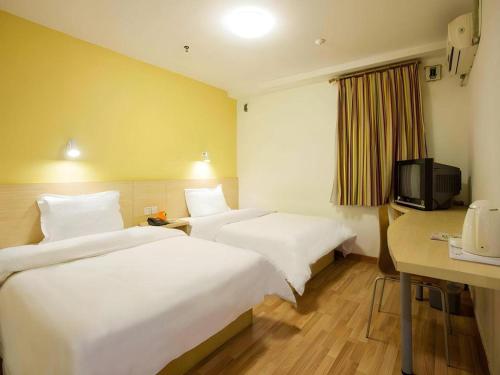 Letto o letti in una camera di 7 Days Inn Tianjin Ancient Cultural Street Jinshiqiao Metro Station