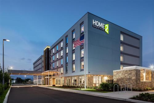 a hotel building with a hilton sign on it at Home2 Suites By Hilton Clearwater St. Petersburg Ulmerton Rd in Clearwater