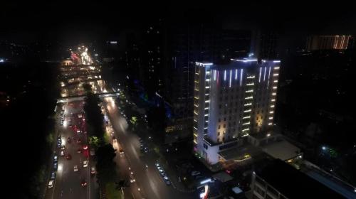 an overhead view of a city at night with traffic at PARK HOTEL Cawang Jakarta in Jakarta