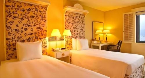 Postel nebo postele na pokoji v ubytování Regency Art Hotel