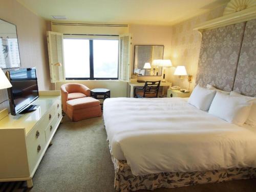 Postel nebo postele na pokoji v ubytování Regency Art Hotel