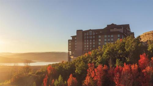 a building on top of a hill with trees at Grand Hyatt Deer Valley in Park City