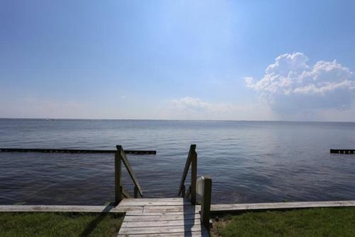 a dock in the middle of a body of water at PS-I -Swan Sea in Duck