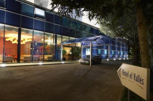 a large glass building with a sign in front of it at Hotel Restaurante El Valles 4 ESTRELLAS in Briviesca