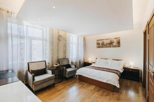 Postel nebo postele na pokoji v ubytování Mika Hotel