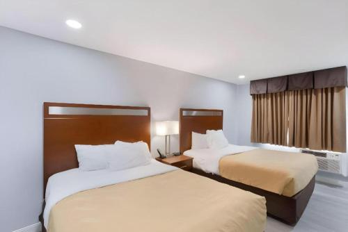 a hotel room with two beds and a window at Quality Inn Redding near I-5 in Redding