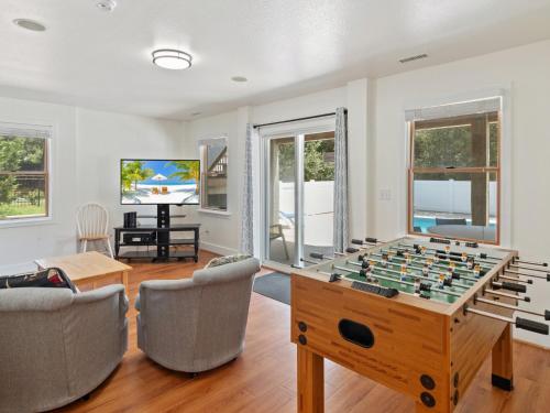 a living room with a foosball table at 2072 - Laughing Duck in Duck