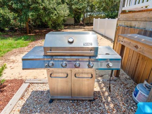 a grill sitting on top of a stove in a backyard at 2072 - Laughing Duck in Duck