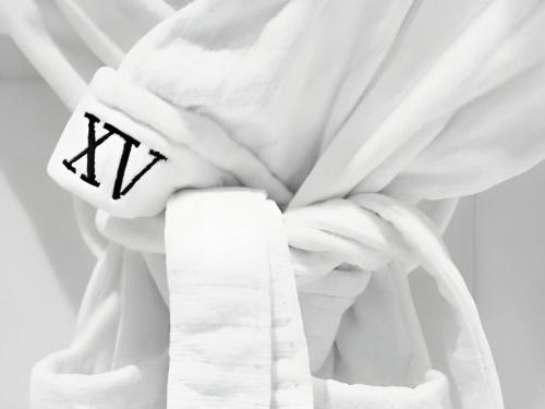 a white curtain with the letter k on it at Fifteen Beacon Hotel in Boston