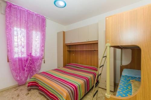 Postel nebo postele na pokoji v ubytování Residence Gabbiano