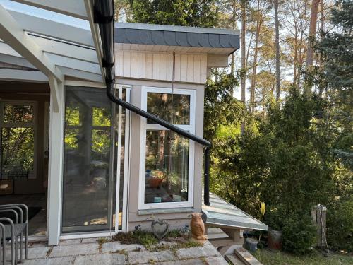 a screened in porch of a house at Lakeside-Hideaway in Schenkendöbern
