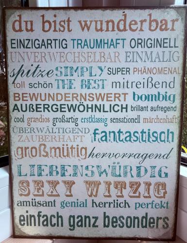 a sign that has some writing on it at Lakeside-Hideaway in Schenkendöbern