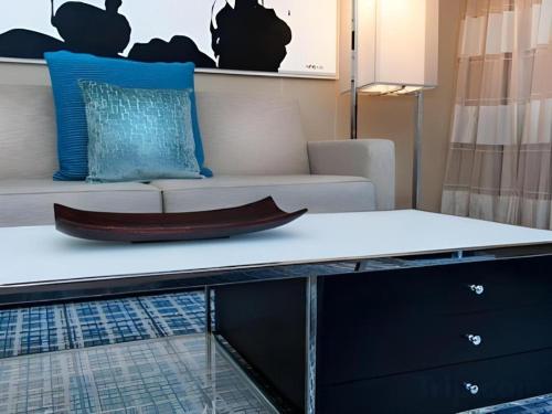 a coffee table in a living room with a couch at Disney's Contemporary Resort in Orlando