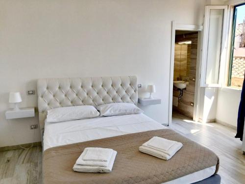 Postel nebo postele na pokoji v ubytování Suite Palazzo Siotto