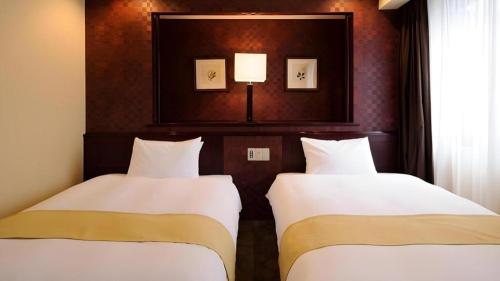 Ένα ή περισσότερα κρεβάτια σε δωμάτιο στο Chisun Hotel Utsunomiya